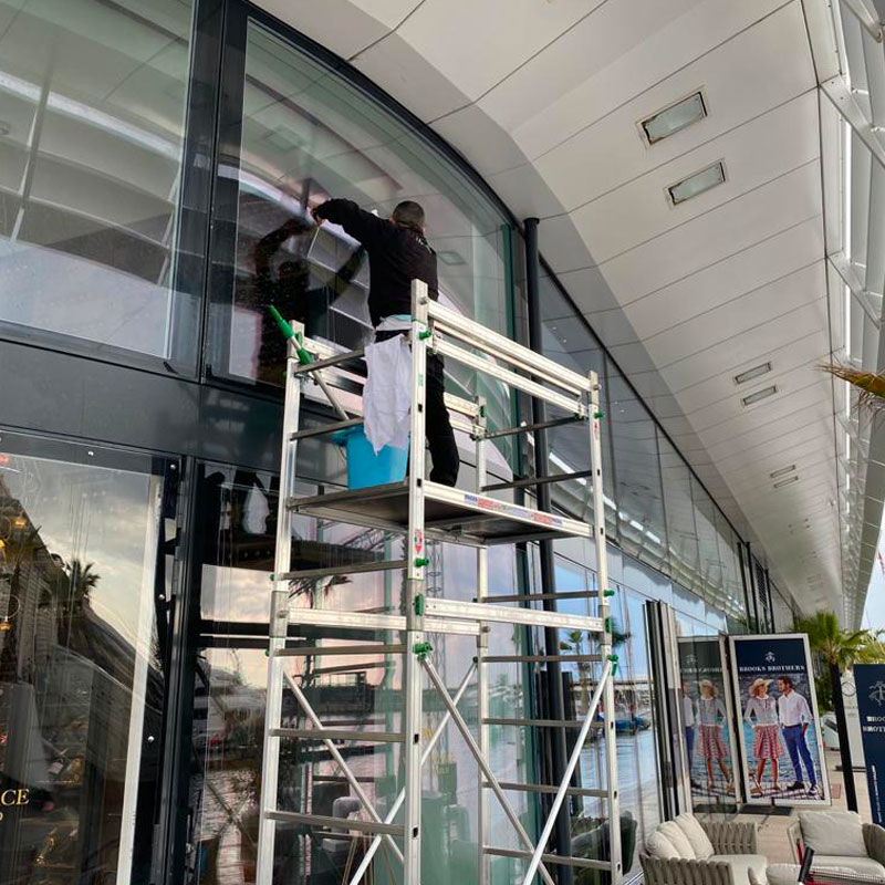 CLEANING shop windows and signs